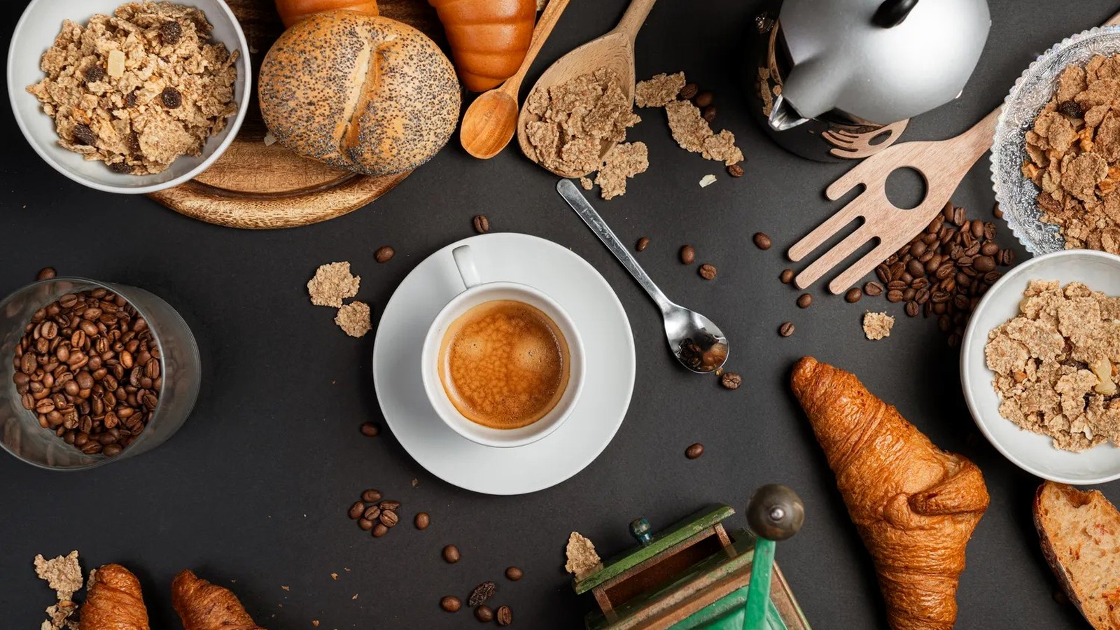 Coffee and breakfast foods arranged on a table